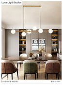 GobekUsa Modern Gold Metal Island Pendant Lighting with 6 Lights and Spherical Glass for Dining Table