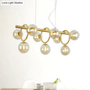 GobekUsa Modern Gold Round Pendant Lighting - 9 Bulb Cognac Glass LED Island Lamp with Linear Design