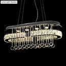 GobekUsa Modern LED Crystal Pendant Light with Stainless Steel Frame and Tassel Accents