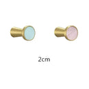 Modern marbled stone and brushed gold towel hook bathroom decor by Decorbites
