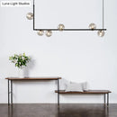 GobekUsa Modern Minimalism Black Linear 6-Light Island Pendant Lighting with Sphere Glass Shade for Living Room.