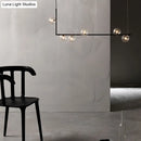 GobekUsa Modern Minimalism Black Linear 6-Light Island Pendant Lighting with Sphere Glass Shade for Living Room.
