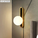 GobekUsa Modern Clear/Cream Glass Orb Wall Light with Brass Mount