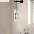 GobekUsa Modern Wall Mounted Clear Glass Cylinder Sconce Light Fixture - 1 Light, Black/Gold