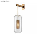 GobekUsa Modern Wall Mounted Clear Glass Cylinder Sconce Light Fixture - 1 Light, Black/Gold