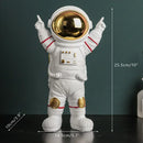 Modern white and electroplated golden astronaut figurines living room decor by Decorbites