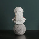 Modern white and electroplated golden astronaut figurines living room decor by Decorbites