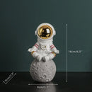 Modern white and electroplated golden astronaut figurines living room decor by Decorbites