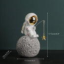 Modern white and electroplated golden astronaut figurines living room decor by Decorbites