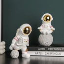 Modern white and electroplated golden astronaut figurines living room decor by Decorbites