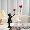 Modern white and red banksy girl balloon sculpture living room decor by Decorbites