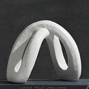 Modern white ceramic infinity symbol vase living room decor by Decorbites