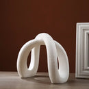 Modern white ceramic infinity symbol vase living room decor by Decorbites
