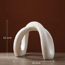 Modern white ceramic infinity symbol vase living room decor by Decorbites