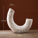 Modern white ceramic infinity symbol vase living room decor by Decorbites