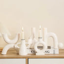 Modern white geometric ceramic candle holders living room decor by Decorbites