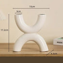Modern white geometric ceramic candle holders living room decor by Decorbites