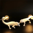 Modern white resin chameleon led table lamp for bedroom reading by Decorbites