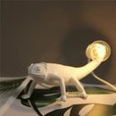 Modern white resin chameleon led table lamp for bedroom reading by Decorbites