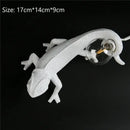 Modern white resin chameleon led table lamp for bedroom reading by Decorbites