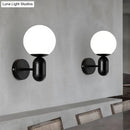 GobekUsa Modern White Wall Lamp with Globe Shade, Capsule Body - Metal & Glass Wall Light for Meeting Room