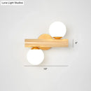 GobekUsa Nordic White Glass Ball Rotating Wall Lamp with Wood Wall Mount - Ideal for Bedroom Lighting