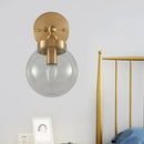 GobekUsa Rotatable Bedroom Wall Lamp in Brass with Clear Glass and Modernist Ball Design