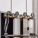 GobekUsa Modernist Clear/Amber/Smoke Glass Pendant Lamp with Linear Design - Cone Island Lighting (6/8 Lights, Black/Brass Ceiling)