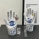 Mystic white & blue ceramic hand jewelry holder stand bedroom decor by Decorbites