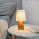 Orange ceramic milkshake bedside lamp with pleated shade for bedroom by Decorbites