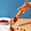 Orange metal cherry pitter fruit core remover kitchen tool by Decorbites