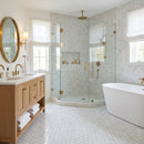 Modern bathroom with wooden vanity, freestanding bathtub, and glass shower enclosure. Palia White Dolomite Mosaic Tile 2" Hexagon on 12" x 12" Mesh - Polished