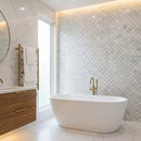 Modern bathroom with freestanding bathtub, wooden vanity, and decorative wall tiles. Palia White Dolomite Mosaic Tile Laguna Pattern on 12" x 12" Mesh - Polished
