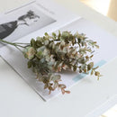 Peach & green eucalyptus leaves artificial arrangement living room vase by Decorbites