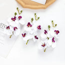 Pink and white artificial flower stems for wedding garden arch decor by Decorbites