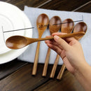 Polished dark brown wooden spoon soup and fork set dining room by Decorbites