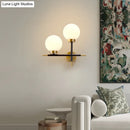 GobekUsa Post-Modern White Glass Sphere Wall Sconce with Brass Finish - 1/2 Bulbs