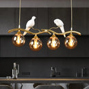 GobekUsa Postmodern Iron Pendant Light with 4-Lights, Black/Gold Finish, Amber Ball Glass Shade, Bird Deco - Sprig Island