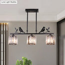 GobekUsa Postmodern Black/Gold Crystal Prism Pendant Lamp with Bird and Leaf Decoration - 3-Bulb Cylinder Hanging Island Light
