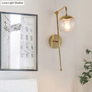 GobekUsa Postmodern Swing Arm Wall Sconce Light with Clear Glass Shade in Black/Gold
