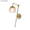 GobekUsa Postmodern Swing Arm Wall Sconce Light with Clear Glass Shade in Black/Gold