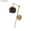 GobekUsa Postmodern Swing Arm Wall Sconce Light with Clear Glass Shade in Black/Gold