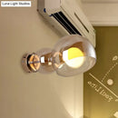 GobekUsa Postmodern Brass Wall Sconce Light with Clear/Amber Glass Shade
