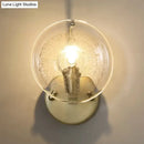 GobekUsa Gold Metal Wall Sconce with Clear Glass Shade - Postmodern 1-Light Fixture