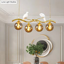 GobekUsa Postmodern Iron Pendant Light with 4-Lights, Black/Gold Finish, Amber Ball Glass Shade, Bird Deco - Sprig Island
