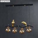 GobekUsa Postmodern Iron Pendant Light with 4-Lights, Black/Gold Finish, Amber Ball Glass Shade, Bird Deco - Sprig Island