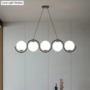 GobekUsa Postmodern Island Light Fixture: Wavy Metallic Hanging Lamp with Glass Shade