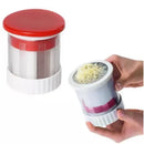 Red and white manual citrus juicer kitchen tool with measuring cup by Decorbites