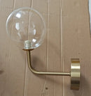 Retro brass curved wall lamp with clear glass ball for bedroom by Decorbites