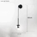 Retro modern glass smoked globe wall lamps for bedroom lighting by Decorbites